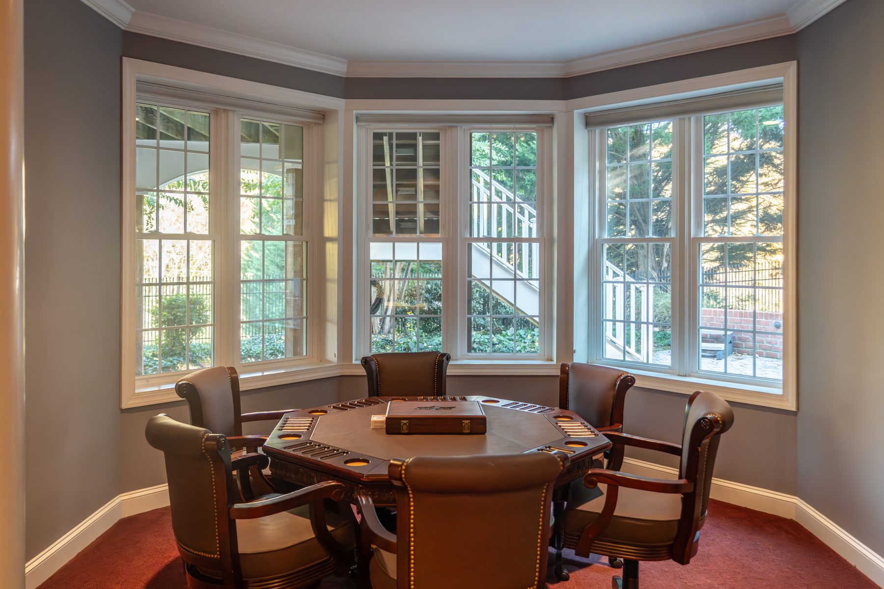 White Vytex Fortis double-hung windows in a bay configuration with colonial grids