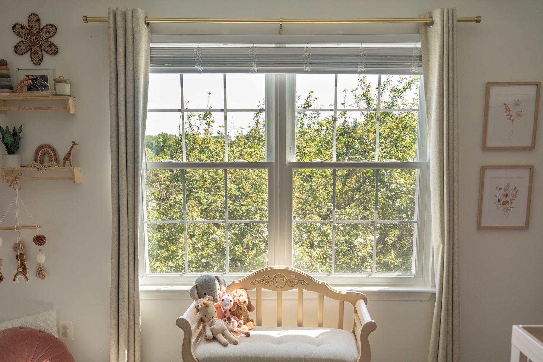 Twin white Vytex Fortis double-hung windows with colonial grids in a bright modern nursery